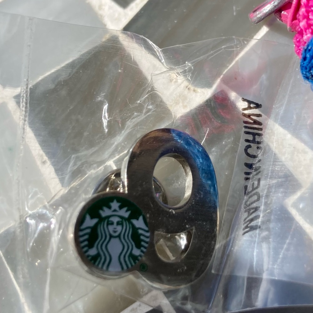 Starbucks anniversary pin 9yr.  Silver color metal with enamel logo.